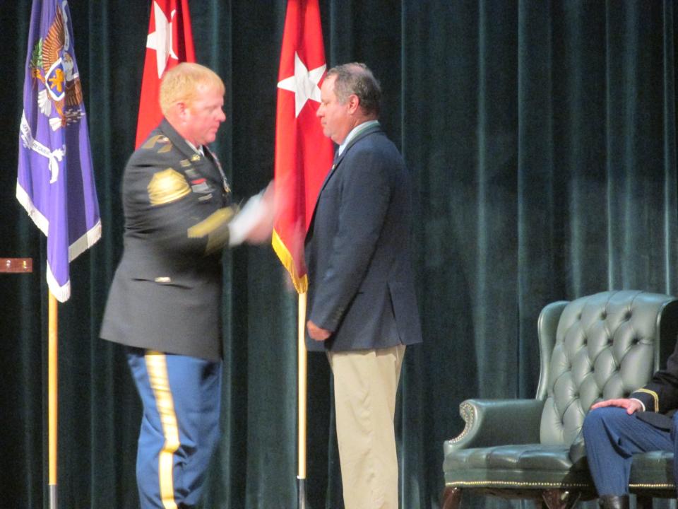 Retired Col. RIchard "Rick" Springett is inducted into as a distinguished member of the psychological operations regiment during a ceremony Thursday, April 20, 2023, at Fort Bragg.