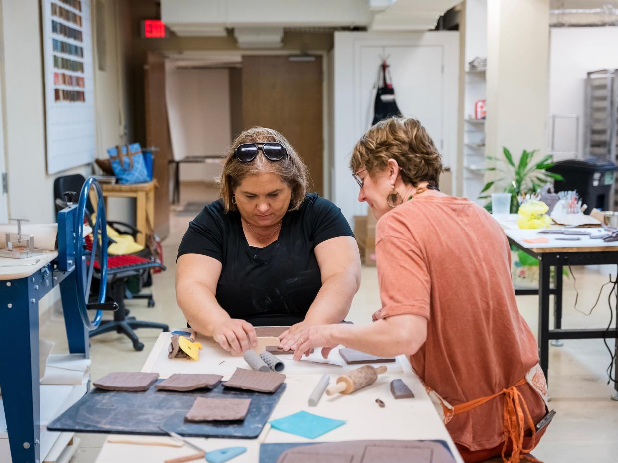 Cary Dahl, right, is the owner of Staunton Clayground, a new pottery studio downtown.