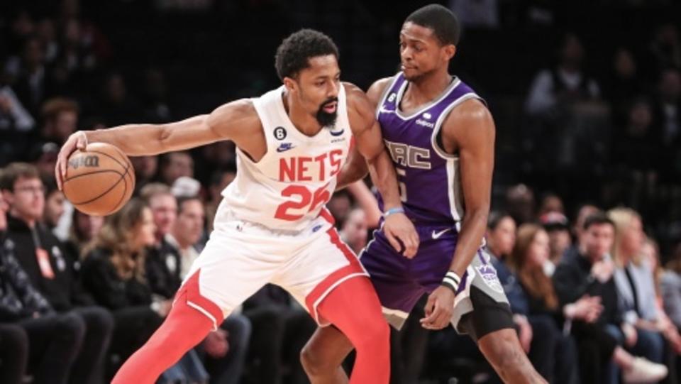 Brooklyn Nets guard Spencer Dinwiddie (26) looks to drive past Sacramento Kings guard De'Aaron Fox (5) in the first quarter at Barclays Center