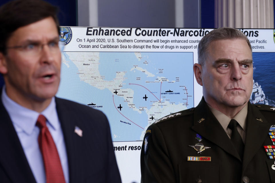 Defense Secretary Mark Esper speaks about the coronavirus and illegal drugs in the James Brady Press Briefing Room of the White House, Wednesday, April 1, 2020, in Washington, as Chairman of the Joint Chiefs Gen. Mark Milley, listens. (AP Photo/Alex Brandon)