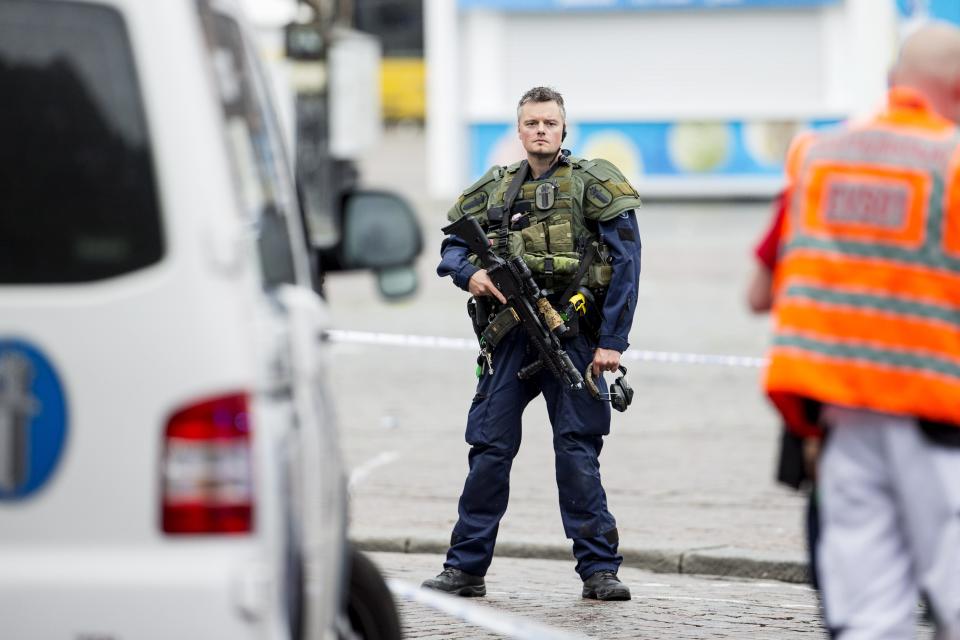 <p>An armed police officer stands guard at the Turku Market Square in the Finnish city of Turku where several people were stabbed on Aug. 18, 2017. (Roni Lehti/AFP/Getty Images) </p>