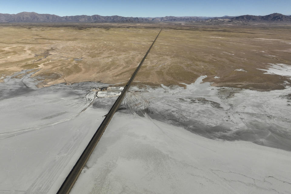 A highway crosses the Salinas Grandes salt flats in the northern Argentine province of Jujuy on April 25, 2023. In 2024, U.S. Secretary of State Antony Blinken underscored the importance Argentina's lithium in a visit to the South American country. "One of the most important to our shared future – in fact, one of the most important to the entire planet – is clean energy," Blinken said. "Argentina is poised to play a critical role in building supply chains for critical minerals that will drive the economy of the 21st century, particularly things like lithium." (AP Photo/Victor R. Caivano)