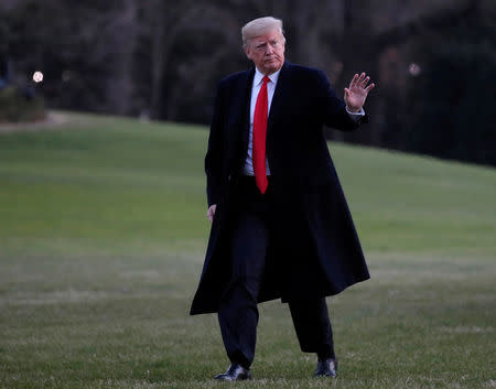 FILE PHOTO: U.S. President Donald Trump walks across the South Lawn after returning to the White House in Washington, U.S., December 7, 2018. REUTERS/Jim Young