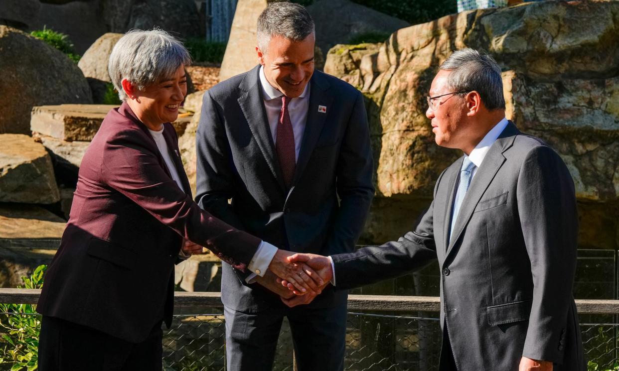 <span>Foreign affairs minister Penny Wong, South Australian premier Peter Malinauskas and Chinese premier Li Qiang during Li's visit on Sunday to the Adelaide zoo.</span><span>Photograph: Asanka Ratnayake/AFP/Getty Images</span>