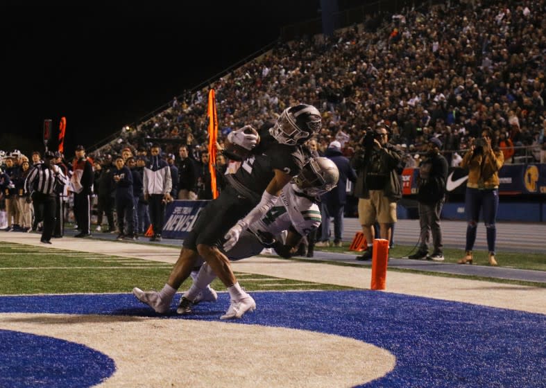 St John Bosco wide receiver Kris Hutson makes a touchdown catch De La Salle defensive back Shamar Garrett on Dec. 14, 2019.