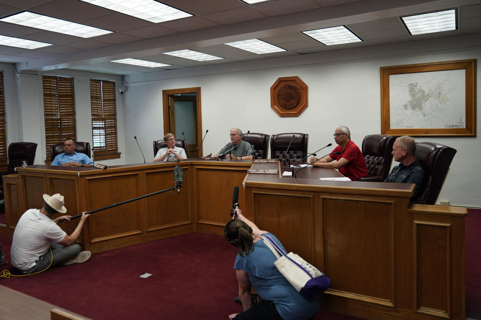 Uvalde Mayor Don McLaughlin, Jr., center, speaks during a special emergency city council meeting to reissue the mayor's declaration of local state of disaster due to the recent school shooting at Robb Elementary School, Tuesday, June 7, 2022, in Uvalde, Texas. Two teachers and 19 students were killed. (AP Photo/Eric Gay)