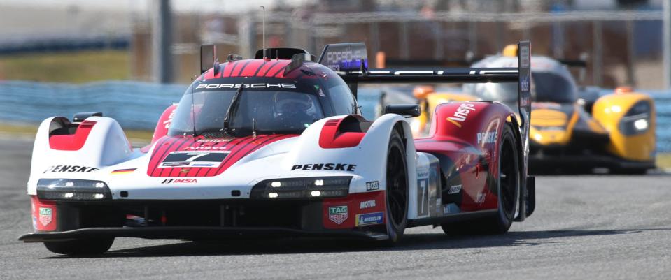 A Team Penske Porsche gets up to speed during Friday's initial test session for the Rolex 24.