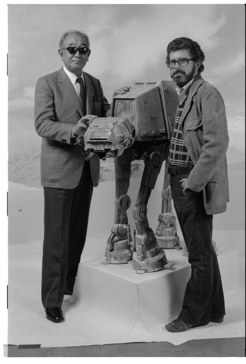 Kurosawa (a Star Wars fan) and Lucas pose with a model of the 