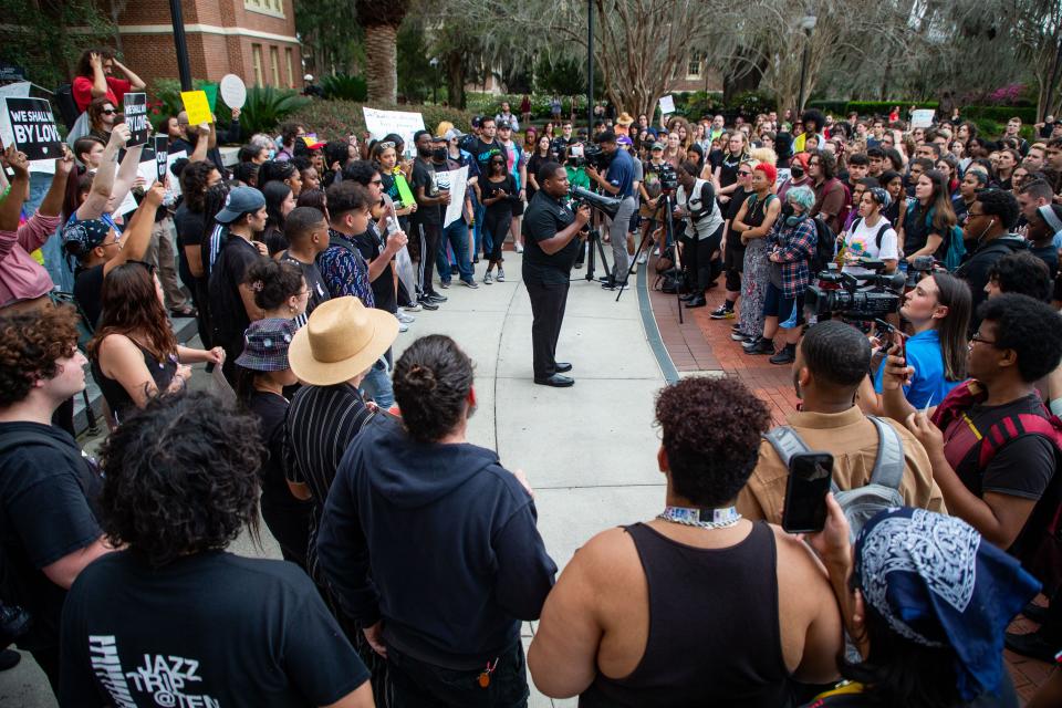 More than 100 people gathered in front of the Westcott Building on Florida State University's campus to protest the DeSantis administration's "attack" on the LGBTQ+ and Black, Indigenous and People of Color (BIPOC) communities on Thursday, Feb. 23, 2023.