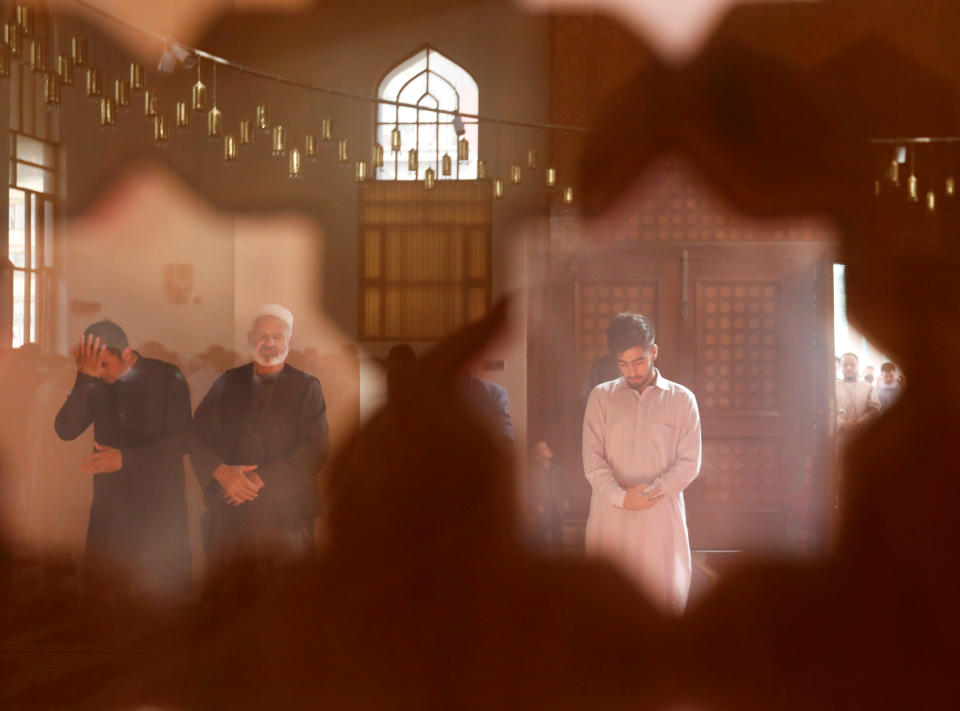 Afghan men take part in prayers during the Muslim festival of Eid al-Adha, amid the spread of the coronavirus disease (COVID-19), in Kabul, Afghanistan July 31, 2020. REUTERS/Mohammad Ismail