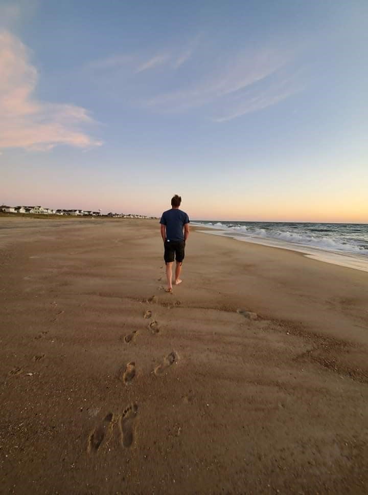 Joseph Johnson walks at Carolina Beach in July 2021.