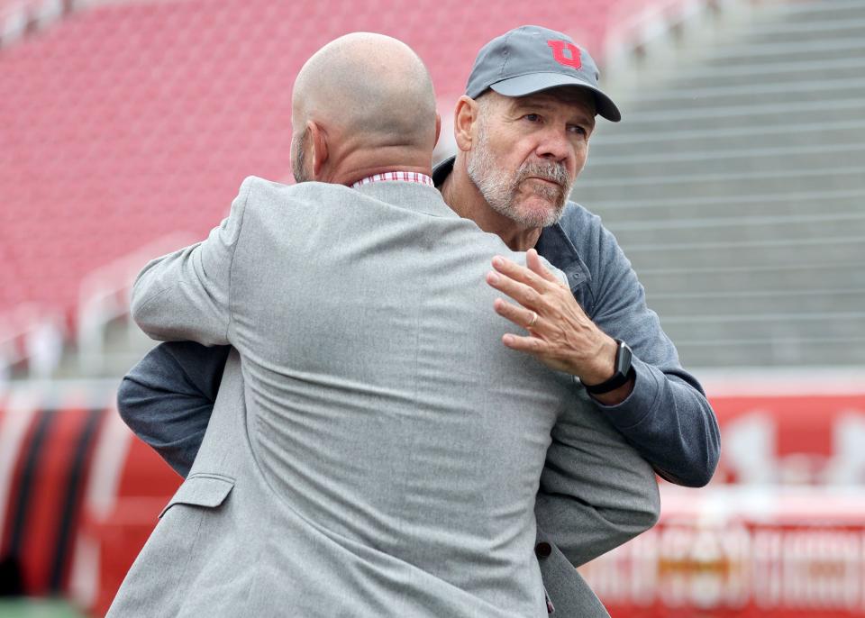 Crimson Collective board member Charlie Monfort, right, hugs Crimson Collective founder Matt Garff at the Crimson Collective launch event at the Rice-Eccles Stadium in Salt Lake City on Friday, April 21, 2023. The Crimson Collective is an independent NIL organization and the exclusive NIL collective for Utah football. | Kristin Murphy, Deseret News
