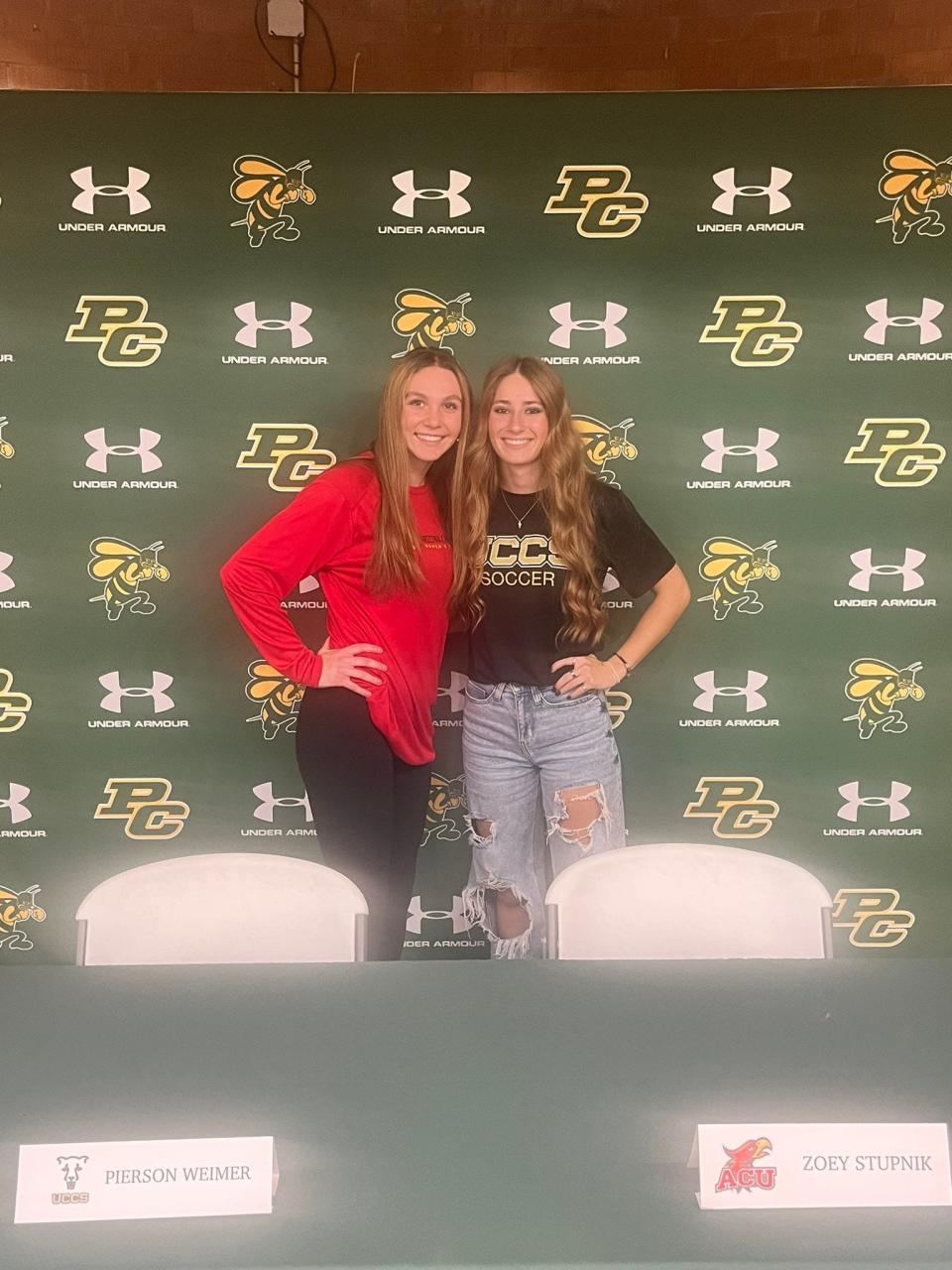Pueblo County Hornets Zoey Stupnik and Pierson Weimer stand by each other after signing their letters of intent to play soccer at the college level