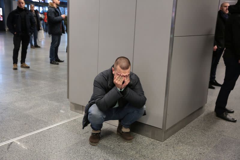 A relative of a victim of the Ukraine International Airlines PS 752 plane that crashed after taking off from Tehran's Imam Khomeini airport reacts at Boryspil International Airport