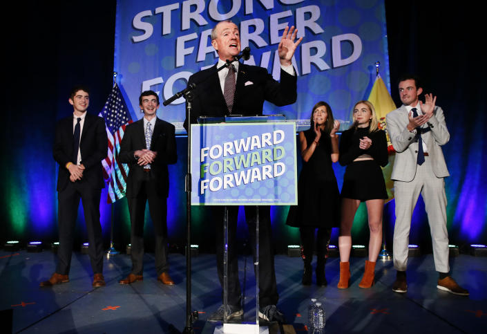 New Jersey Governor Phil Murphy delivers his victory speech with wife Tammy, sons Josh, Charlie and daughter Emma watch at Convention Hall, after winning gubernatorial race against Jack Ciattarelli Wednesday, Nov. 3, 2021, in Asbury Park, N.J. (AP Photo/Noah K. Murray)