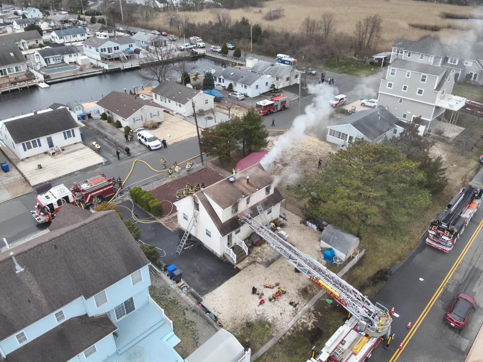 Firefighters attempt to extinguish a fire at a Bergen Avenue home in Toms River on Saturday, March 9, 2024.