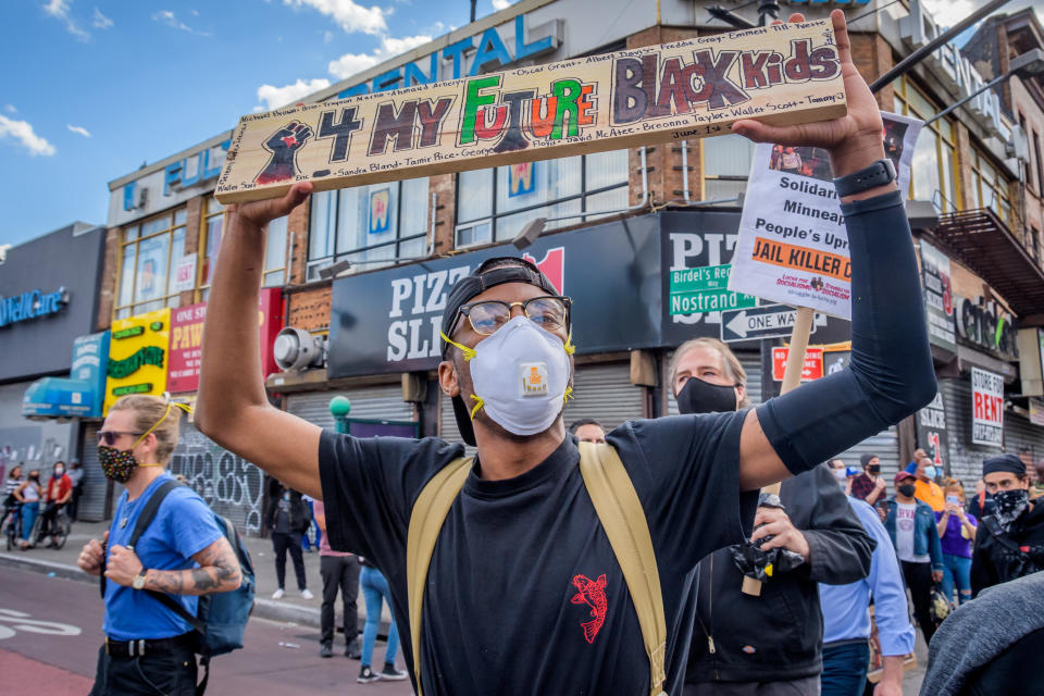 <i>On June 1, a protester in Brooklyn, New York, holds a sign that reads: "4 my future Black kids."</i>