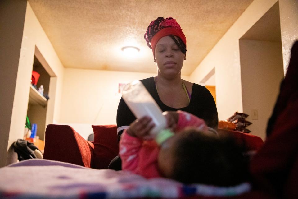 Nickeatrice McDowell, who goes by Keekee, changes her six-month-old daughter Faith Cook’s diaper in her apartment on Wednesday, November 15, 2022, in Jackson, Tenn. McDowell said it can be difficult at times trying to do everything for her kids while she’s home without a job or child care but that it always feels worth it. "It's always fun. It's a love I've never experienced before,” she said. “Now I can teach them what I was never taught. How to take care of themselves. How to be a good person, how to be honest." Lack of child care options continues to be a barrier in Jackson and across the state and U.S.