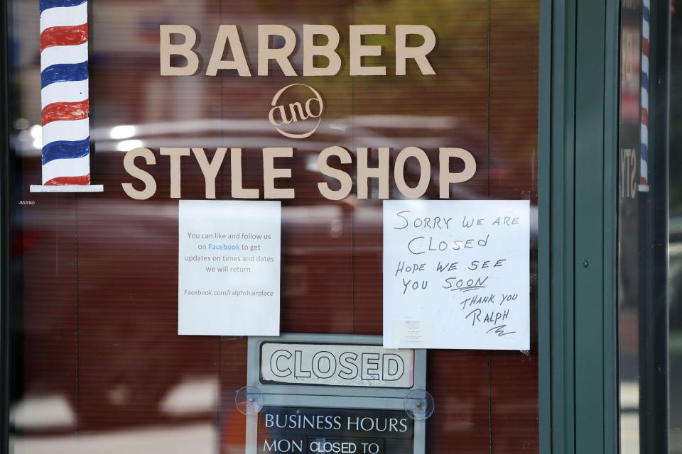 A barber shop remains closed because of the coronavirus outbreak Tuesday, May 19, 2020, in Seattle. Washington state Gov. Jay Inslee on Tuesday announced $10 million in grants to small businesses in industries particularly hard-hit by the COVID-19 outbreak. They include restaurants, hair salons, fitness studios and theaters. (AP Photo/Elaine Thompson)
