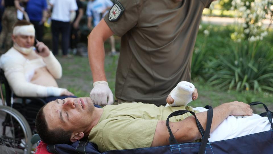 'Liahk,' 34, a wounded Ukrainian soldier is transported to a hospital in Dnipro, Eastern Ukraine.