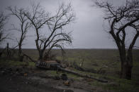 The turret of a destroyed tank is pictured outside Kalynivske, Ukraine, Saturday, Jan. 28, 2023. (AP Photo/Daniel Cole)