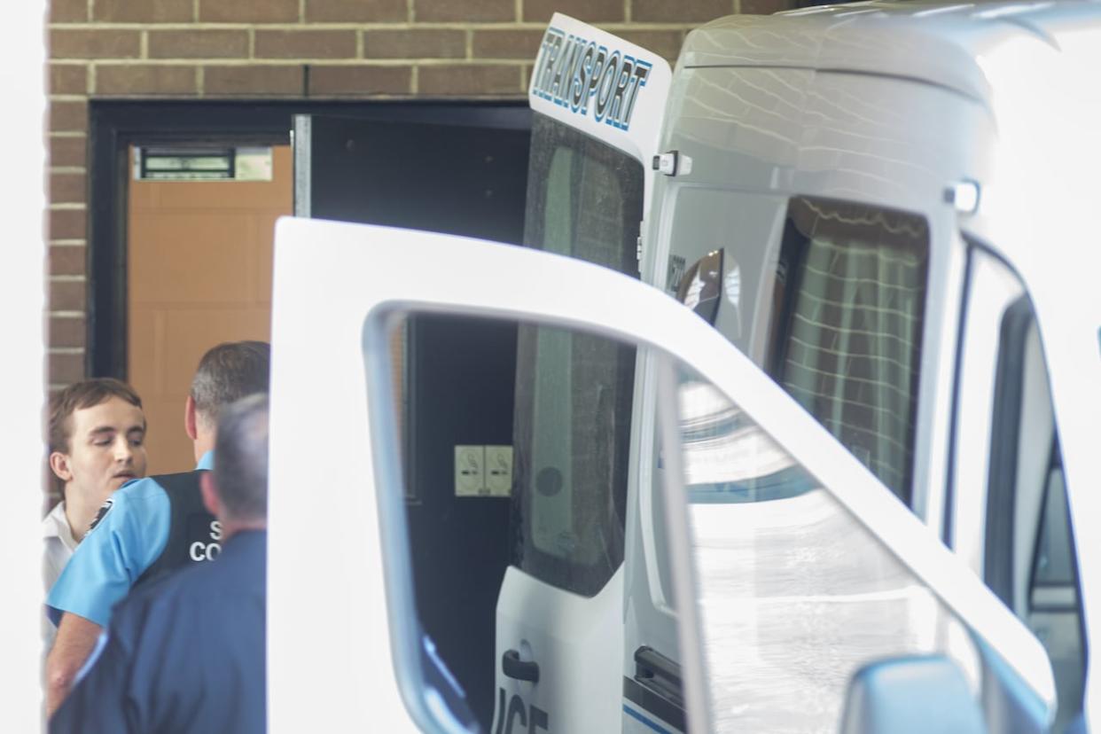 Nathaniel Veltman is escorted leaving trial outside Ontario Superior Court in Windsor, Ont., on Tuesday.  (Dax Melmer/The Canadian Press - image credit)