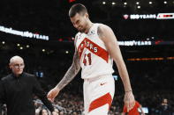 Toronto Raptors' Juancho Hernangomez winces as he leaves the game after an injury during the first half of an NBA basketball game against the Orlando Magic, Saturday, Dec. 3, 2022 in Toronto. (Chris Young/The Canadian Press via AP)