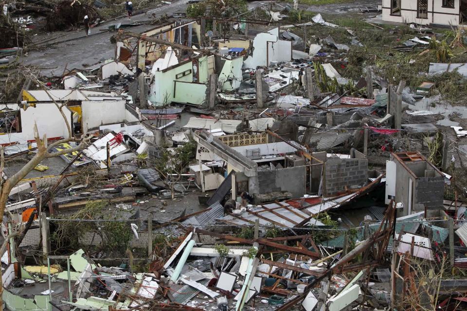 Damaged houses near the airport are seen after super Typhoon Haiyan battered Tacloban city, central Philippines, November 9, 2013. Possibly the strongest typhoon ever to hit land devastated the central Philippine city of Tacloban, killing at least 100 people, turning houses into rubble and leveling the airport in a surge of flood water and high wind, officials said on Saturday. The toll of death and damage from Typhoon Haiyan on Friday is expected to rise sharply as rescue workers and soldiers reach areas cut off by the massive, fast-moving storm which weakened to a category 4 on Saturday. REUTERS/Romeo Ranoco (PHILIPPINES - Tags: DISASTER ENVIRONMENT)