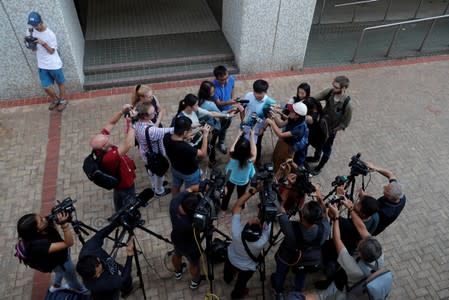 Joshua Wong, secretary-general of Hong Kong's pro-democracy Demosisto party, talks to the media before submitting his application for his race in the 2019 District Council Election at the Southern District Office in Hong Kong