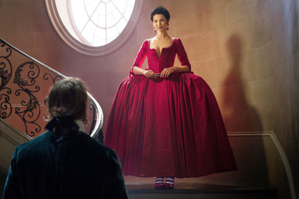 Jamie looking astonished at Claire as she descends down the stairs