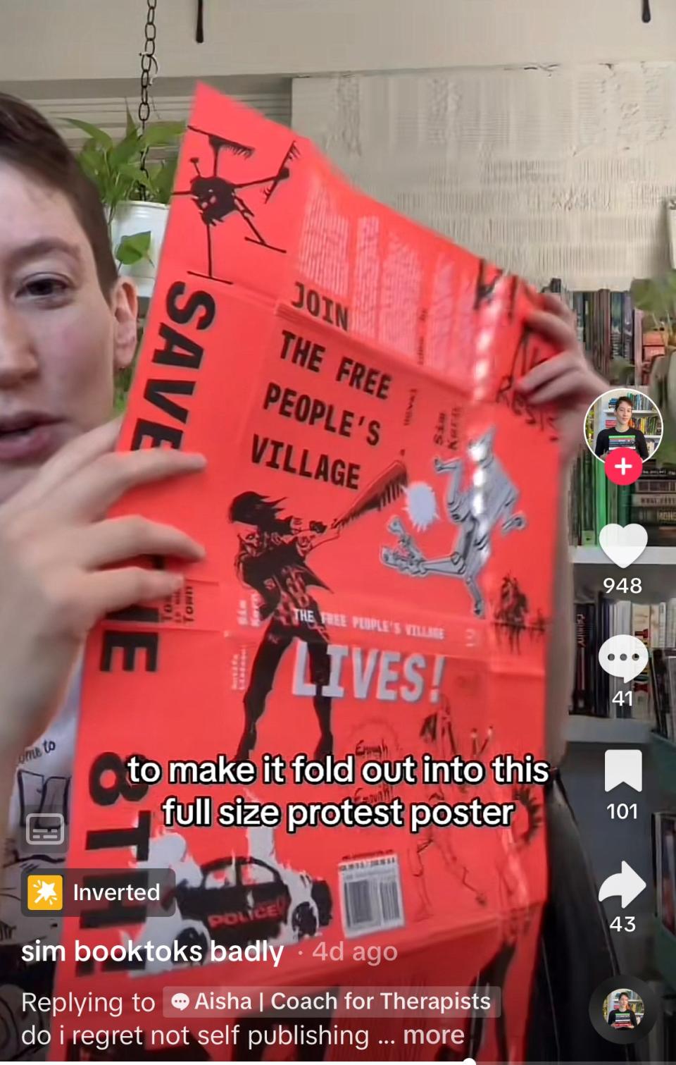 Sim showing how the dust jacket for the hardcover of their book folds out into a full-size protest poster