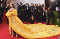 <p>Riri’s yoke-yellow dress left the Internet <a rel="nofollow noopener" href="http://edition.cnn.com/2015/05/06/entertainment/rihanna-yellow-cape-guo-pei-met-gala/index.html" target="_blank" data-ylk="slk:scrambling for jokes;elm:context_link;itc:0;sec:content-canvas" class="link ">scrambling for jokes</a>. <i>(Photo via Getty Images)</i> </p>