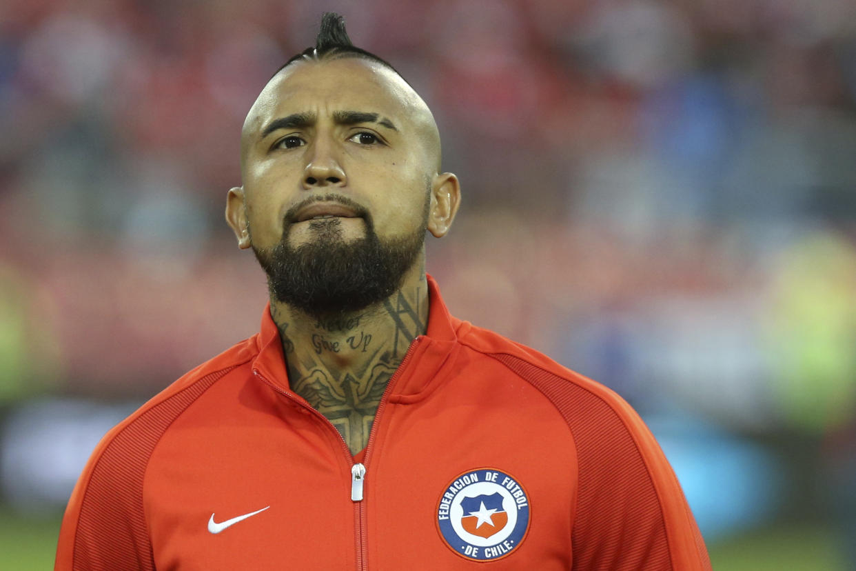 Chile’s Arturo Vidal listens to the national anthems prior to a 2018 World Cup qualifying soccer match against Paraguay in Santiago, Chile, Thursday, Aug. 31, 2017. (AP Photo/Esteban Felix)