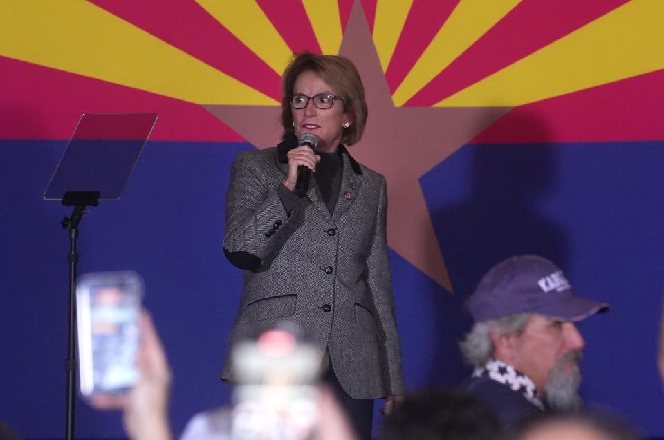 State Senator Wendy Rogers speaks to a crowd gathered for Kari Lake, the former GOP candidate for governor, during a rally with supporters at the Orange Tree Golf Club in Scottsdale on Jan. 29, 2023.