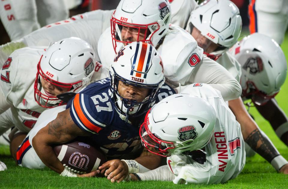 Auburn Tigers running back Jarquez Hunter (27) checks the sideline after being tackled as Auburn Tigers take on New Mexico Lobos at Jordan-Hare Stadium in Auburn, Ala., on Saturday, Sept. 14, 2024. Auburn Tigers defeated New Mexico Lobos 45-19.