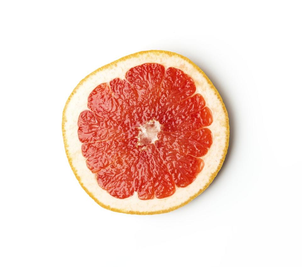 ripe slice of pink grapefruit citrus fruit isolated on white background red grapefruit segment ready to eat ripe cut citrus sliced grapefruit on white background