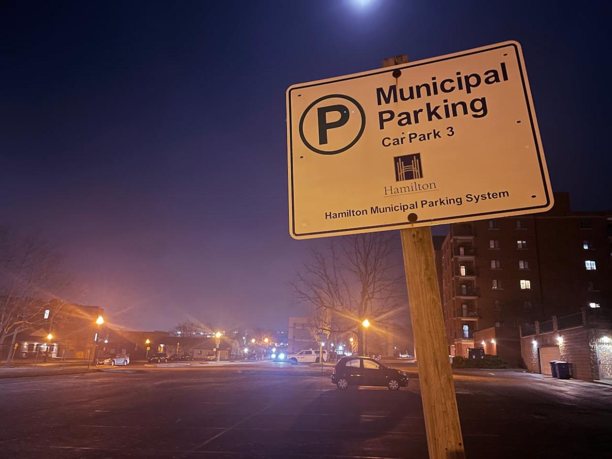 The municipal parking lot off of Lake Avenue South in Stoney Creek, shown here on Thursday evening, would be impacted by a proposed affordable housing development. (Eva Salinas/CBC - image credit)