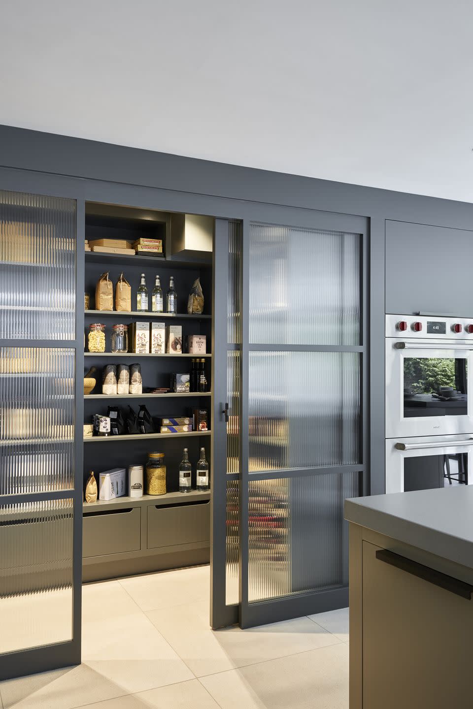 <p>Give your pantry an element of privacy with frosted glass sliding doors. We love that it feels like part of the kitchen while also being its own room. </p><p>• See more from <a href="https://mowlemandco.com/" rel="nofollow noopener" target="_blank" data-ylk="slk:Mowlem & Co;elm:context_link;itc:0;sec:content-canvas" class="link ">Mowlem & Co</a></p>