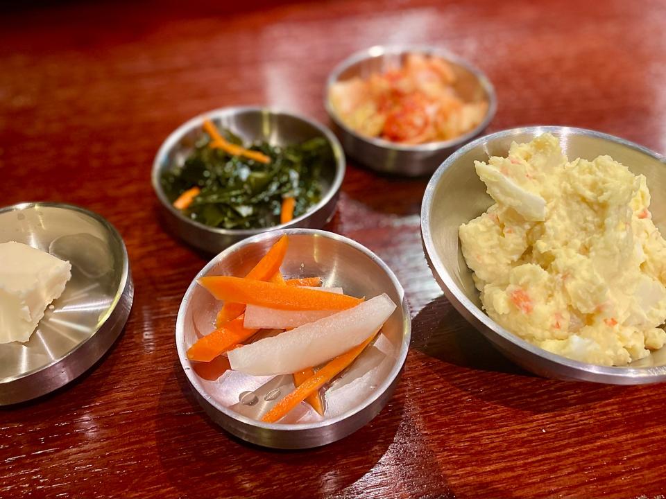 Potato and egg salad, sweet and sour seaweed, and kimchi, among other sides at Hanwoo Korean BBQ in Port Orange.