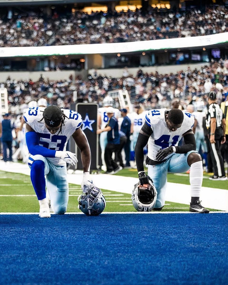 Former Florida A&M Rattlers players linebacker Isaiah Land (53) and safety Markquese Bell (41) kneels pregame of the Dallas Cowboys preseason contest against the Jacksonville Jaguars at AT&T Stadium in Arlington Stadium, Saturday, Aug. 2023.