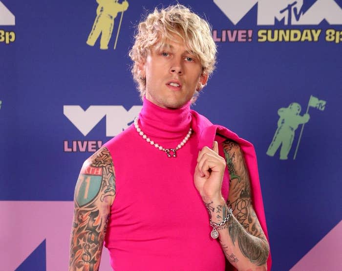 A close-up of MGK at the VMAs red carpet