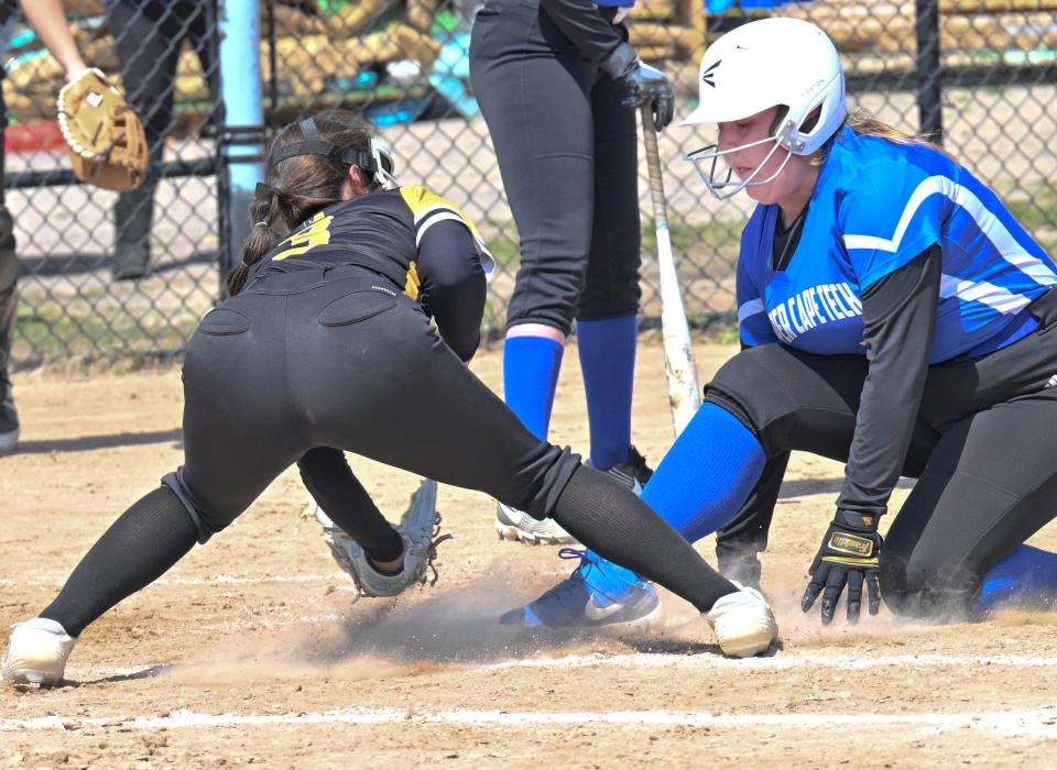 BOURNE 4/18/23 Emma King of Upper Cape Tech arrives safely at home ahead of the tag by Nauset pitcher Kaylee Davis.