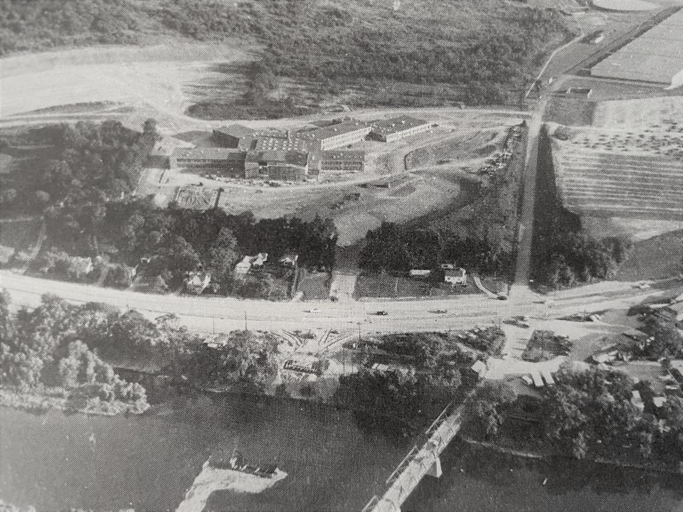 The fifth bridge under construction in 1956, with the Chenango Valley Central School District buildings nearby.