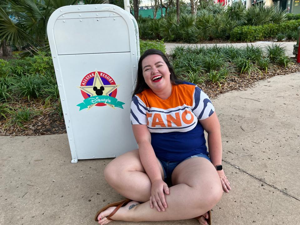 megan posing with a retro disney trash can at disney's all star resorts