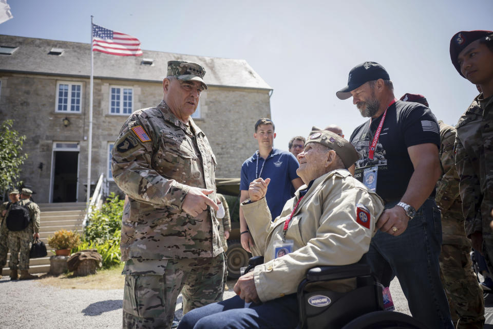 U.S. Gen. Mark Milley, left, meets a veteran during a gathering in preparation of the 79th D-Day anniversary in La Fiere, Normandy, France, Sunday, June 4, 2023. The landings on the coast of Normandy 79 year ago by U.S. and British troops took place on June 6, 1944. (AP Photo/Thomas Padilla)