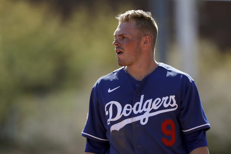 Los Angeles Dodgers second baseman Gavin Lux looks on during the third inning of a spring training baseball game against the Los Angeles Angels, Wednesday, Feb. 26, 2020, in Glendale, Ariz. (AP Photo/Gregory Bull)