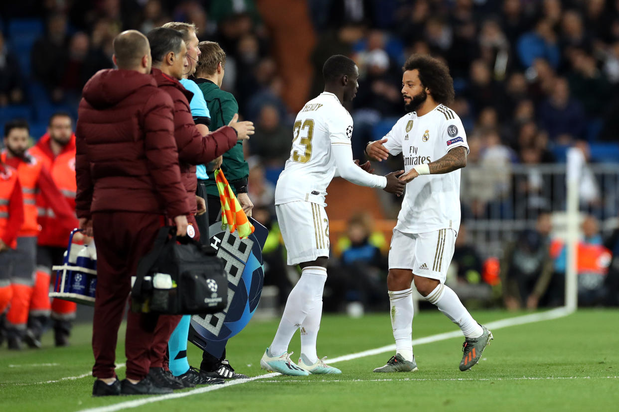 MADRID, SPAIN - NOVEMBER 06: Marcelo is substituted by Ferland Mendy of Real Madrid during the UEFA Champions League group A match between Real Madrid and Galatasaray at Bernabeu on November 06, 2019 in Madrid, Spain. (Photo by Angel Martinez/Getty Images)