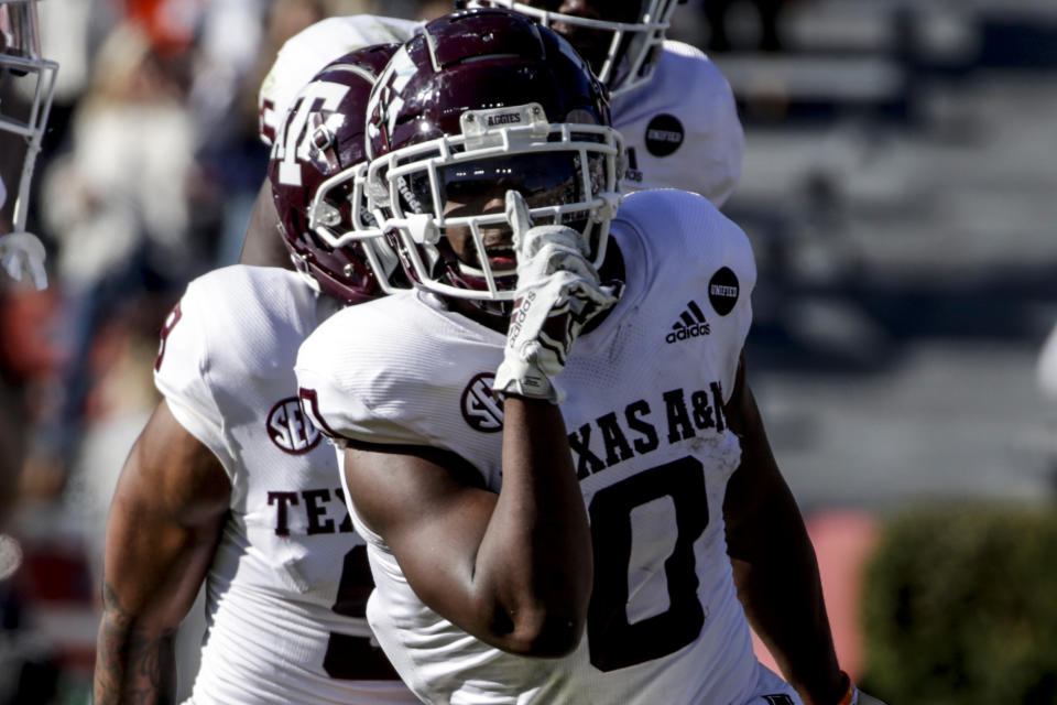 Texas A&M running back Ainias Smith (0) reacts after scoring a touchdown against Auburn during the second half of an NCAA college football game on Saturday, Dec. 5, 2020, in Auburn, Ala. (AP Photo/Butch Dill)
