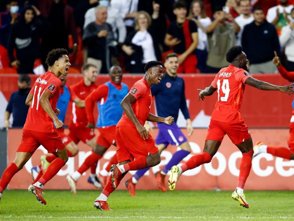 Alphonso Davies, right, Jonathan David, middle, and Tajon Buchanan are all part of Canada's 26-man roster for the upcoming FIFA World Cup in Qatar. (Vaughn Ridley/Getty Images/File - image credit)