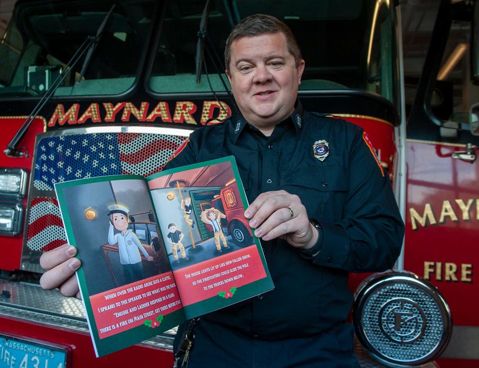 Maynard fire Capt. Michael Parr holds his new book, "A Firehouse's Night Before Christmas," at the Maynard Fire Dept. headquarters, Dec. 7, 2023. Parr lives in Northborough, where he works part time in its fire department.